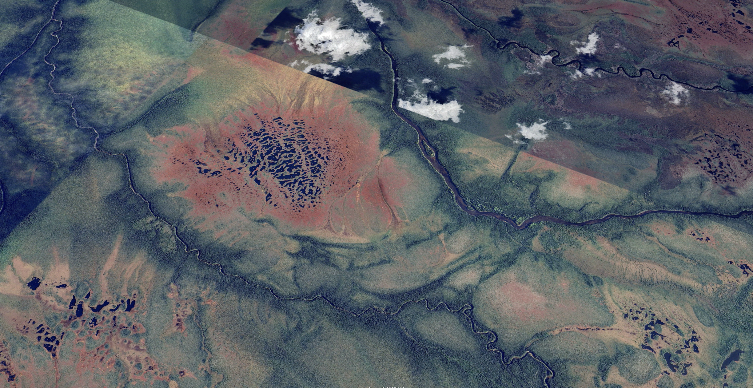 Vast peatland expanse with esker ridge and rivers